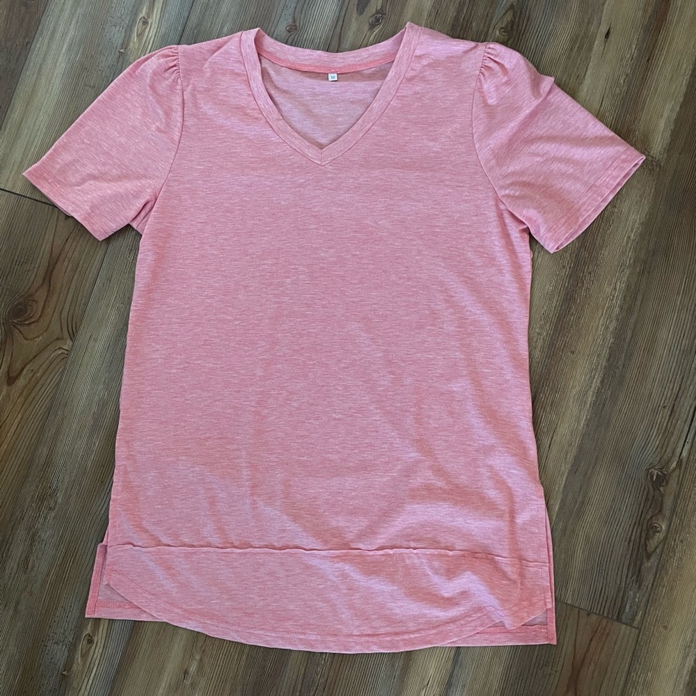 Medium tshirt. Brand new. Never worn. Coral color from Amazon.